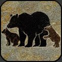 Stone mosaic silhouette bear with two cubs.